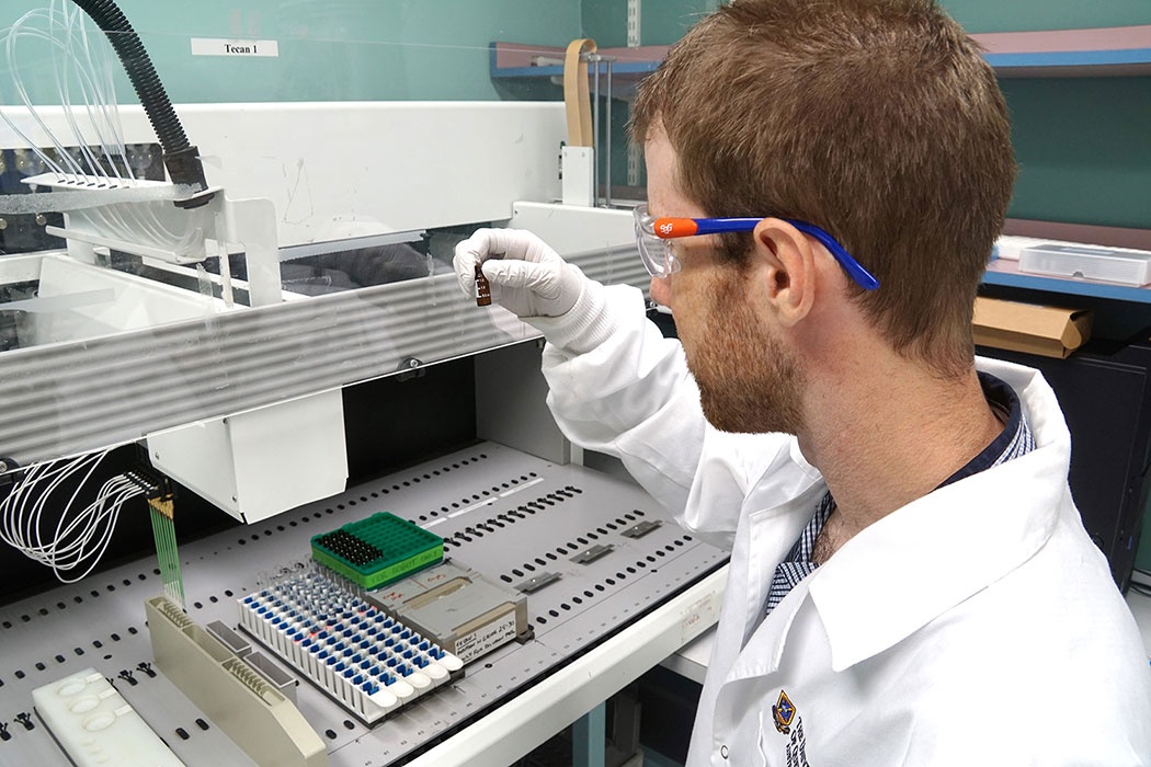 Photo: A University of Queensland researcher testing wastewater as part of the National Wastewater Drug Monitoring Program (image courtesy of ACIC)