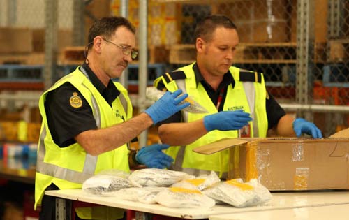 ABF officers examining packages